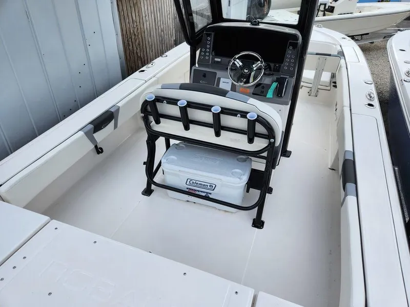 Slide: The Image of 2023 Robalo 266 Cayman boat interior with steering console and seating. - 5