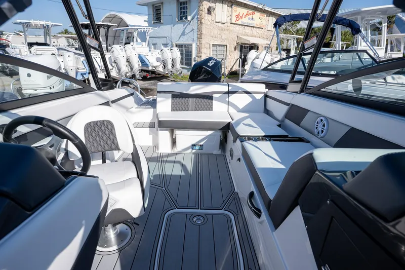 Slide: The Image of 2024 Monterey M-225 boat interior with modern seating and sleek design. - 10
