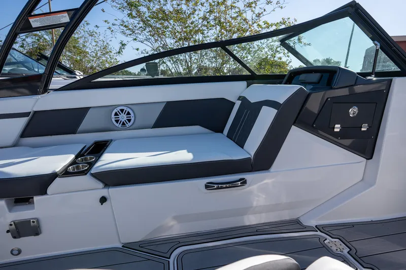 Slide: The Image of 2024 Monterey M-225 boat interior with sleek seating and modern design elements. - 12