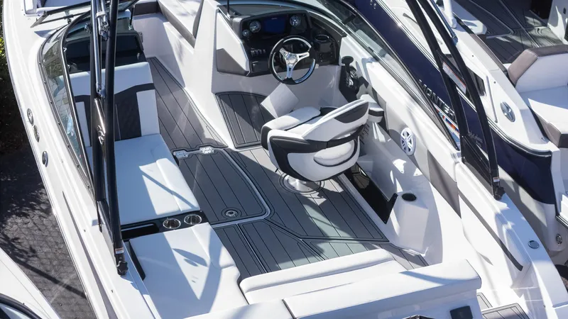 Slide: The Image of 2024 Monterey M-225 boat interior with sleek seating and modern dashboard design. - 4