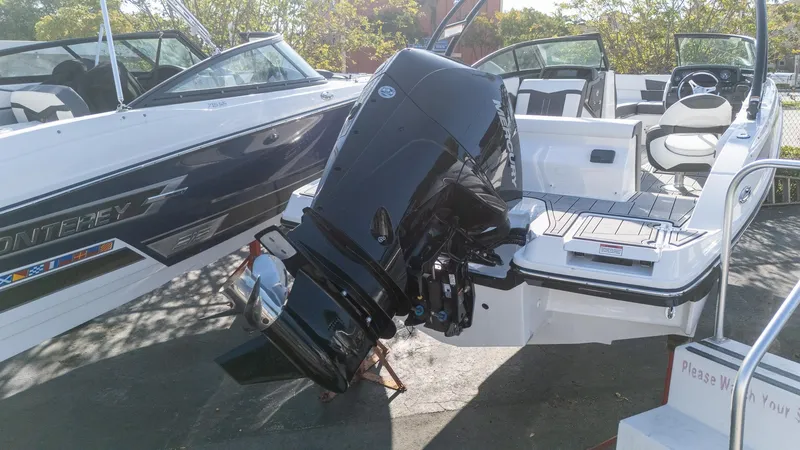 Slide: The Image of 2024 Monterey M-225 boat with Mercury outboard engine, displayed outdoors. - 6