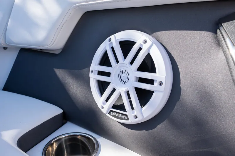 Slide: The Image of 2024 Monterey M-225 boat interior with Rockford Fosgate speaker and cup holder. - 9