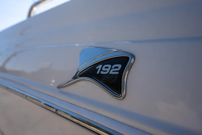 Slide: The Image of 2024 Stingray 192SC boat emblem on sleek white surface. - 7
