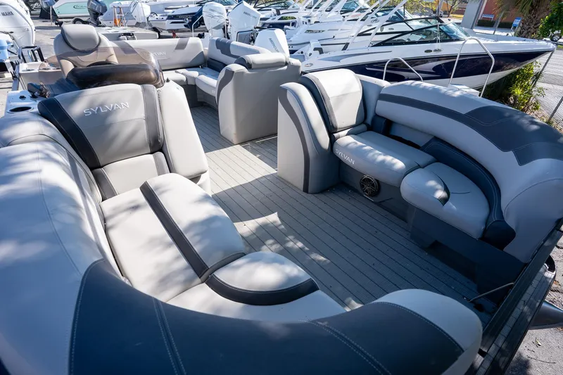 Slide: The Image of 2024 Sylvan L3 DLZ Bar pontoon boat with luxurious seating and modern design. - 12