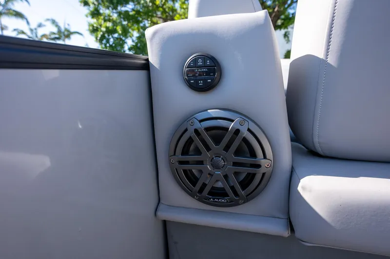 Slide: The Image of 2024 Sylvan L3 DLZ Bar boat speaker and control panel, featuring JL Audio system. - 7