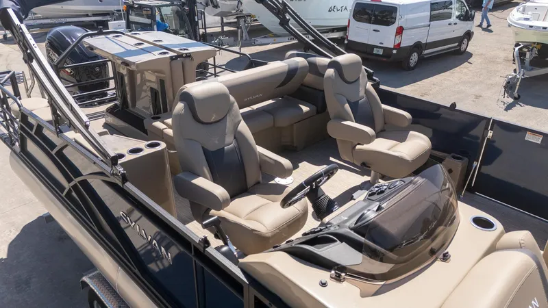 Slide: The Image of 2024 Sylvan L3 DLZ Bar pontoon boat with luxurious seating and modern design. - 5