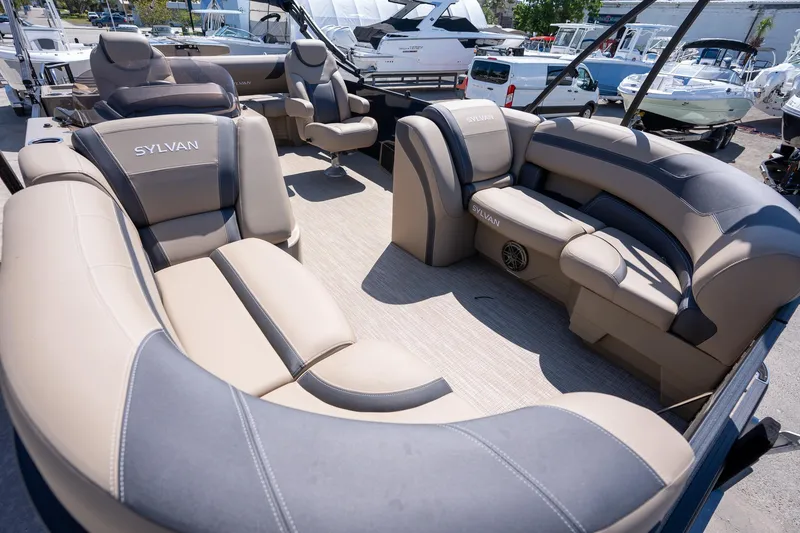 Slide: The Image of 2024 Sylvan L3 DLZ Bar pontoon boat with luxurious seating and modern design. - 9