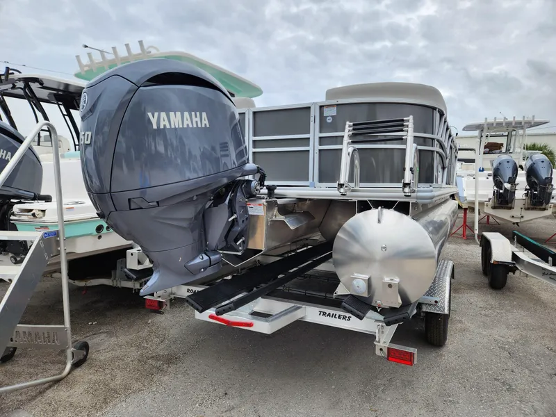 Slide: The Image of 2024 Sylvan 822 LZ pontoon boat with Yamaha outboard motor on trailer. - 3