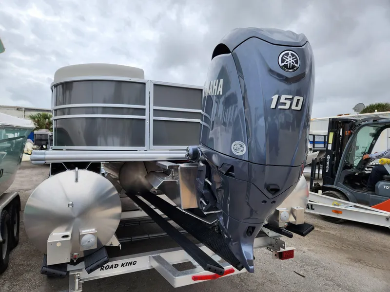 Slide: The Image of 2024 Sylvan 822 LZ pontoon boat with Yamaha 150 outboard motor on trailer. - 4