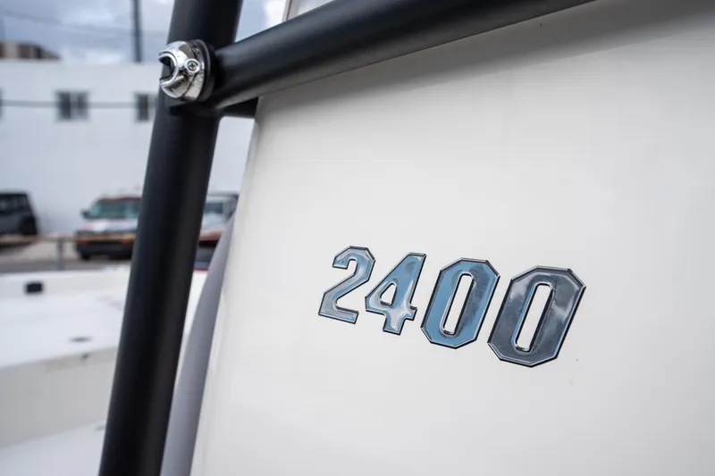 Slide: The Image of Pathfinder 2400 Open 2025 model boat detail with chrome lettering. - 11