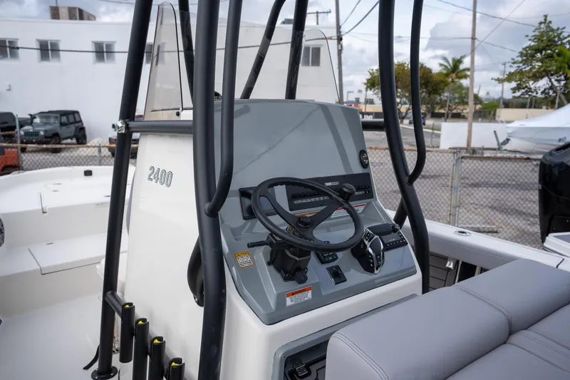 Slide: The Image of 2025 Pathfinder 2400 Open boat console with steering wheel and controls. - 12
