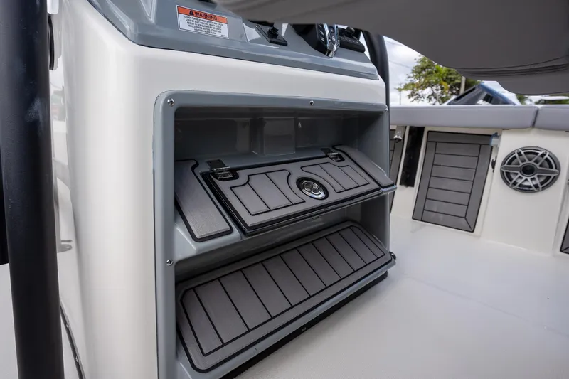 Slide: The Image of 2025 Pathfinder 2400 Open boat storage compartments and speaker detail. - 13