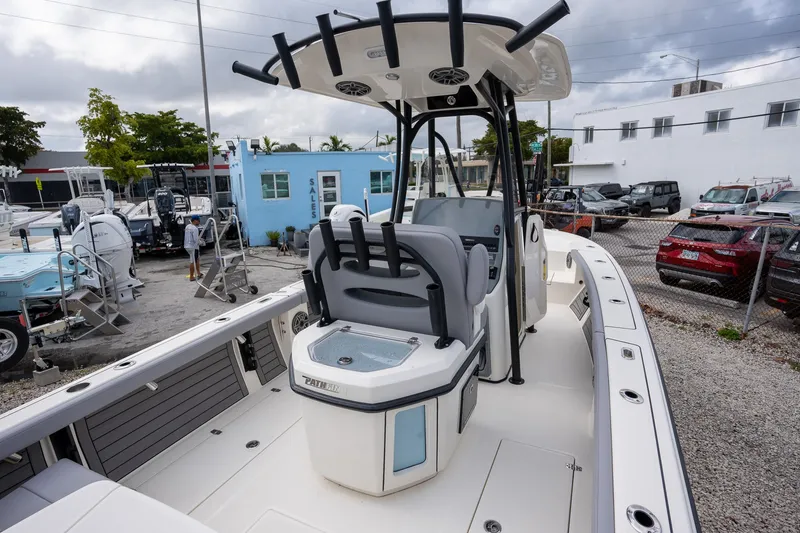 Slide: The Image of 2025 Pathfinder 2400 Open boat at a dealership, showcasing interior and console features. - 4
