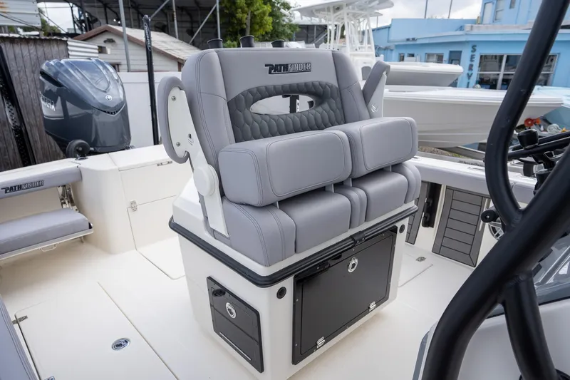 Slide: The Image of 2025 Pathfinder 2400 Open boat interior with cushioned seating and storage. - 6