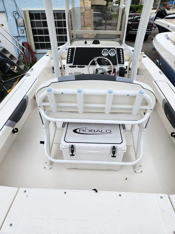 Slide: The Image of 2023 Robalo 226 Cayman boat interior with console and seating. - 2