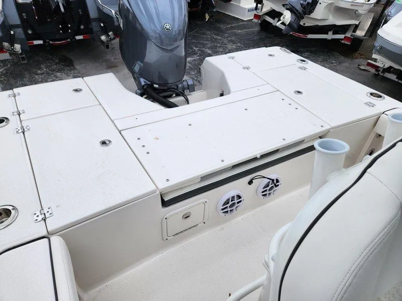 Slide: The Image of 2023 Robalo 226 Cayman boat deck with motor and storage compartments. - 3