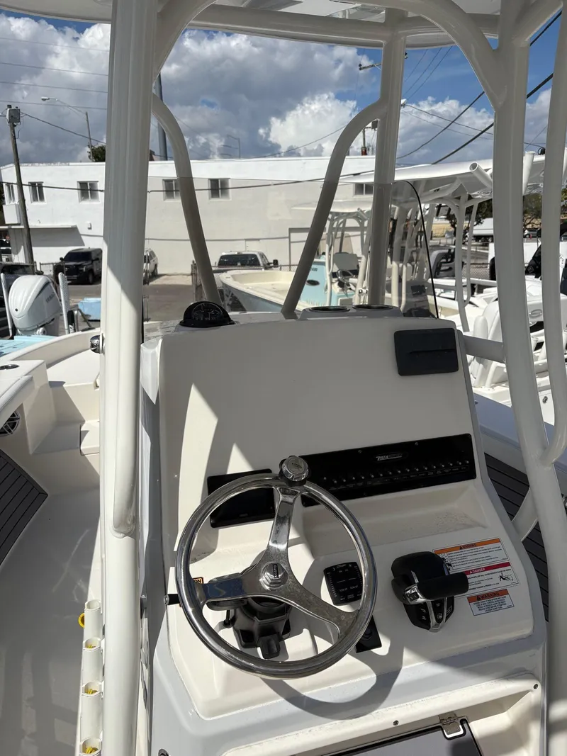 Slide: The Image of 2024 Pathfinder 2700 Open boat console with steering wheel and controls. - 3