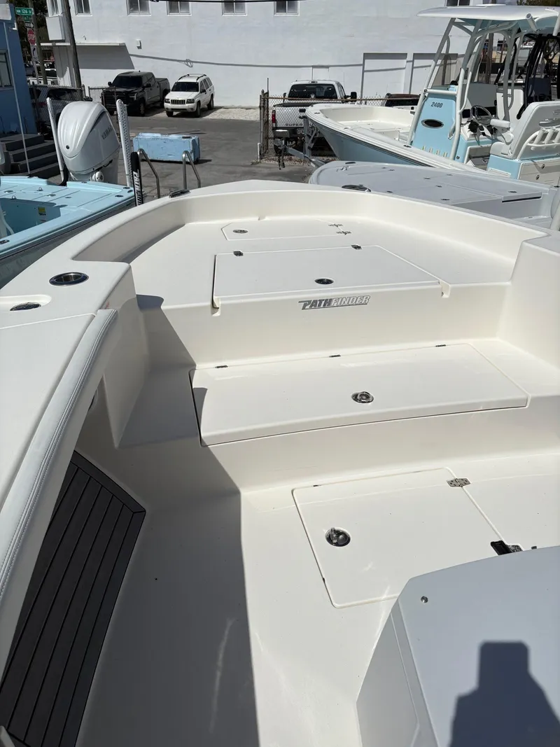 Slide: The Image of 2024 Pathfinder 2700 Open boat interior, featuring spacious seating and storage compartments. - 5