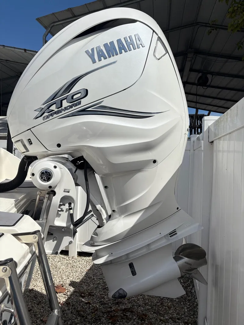 Slide: The Image of Yamaha XTO Offshore engine on 2024 Pathfinder 2700 Open boat, parked outdoors. - 6