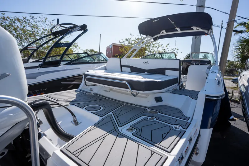 Slide: The Image of 2023 Monterey 275SS boat with sleek design and spacious deck, showcased outdoors. - 10