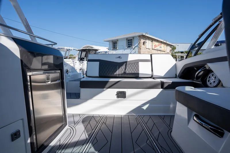 Slide: The Image of 2023 Monterey 275SS boat interior with sleek seating and modern design. - 14