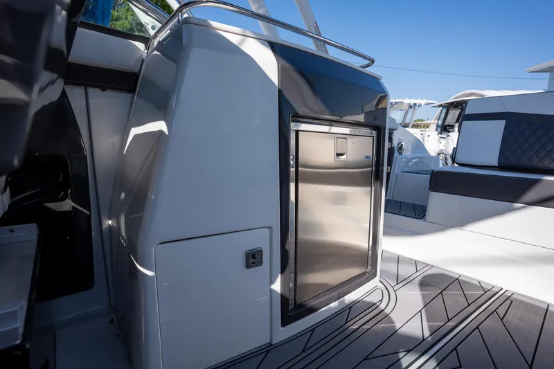 Slide: The Image of 2023 Monterey 275SS boat interior with sleek design and stainless steel features. - 15