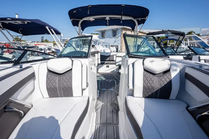 Slide: The Image of 2023 Monterey 275SS boat interior with luxurious seating and sleek design. - 18