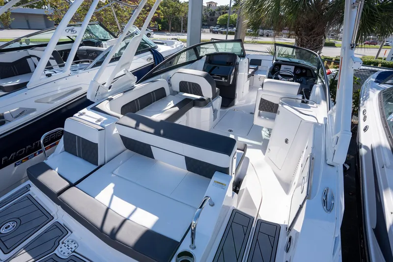 Slide: The Image of 2023 Monterey 275SS boat interior with sleek seating and modern dashboard. - 21