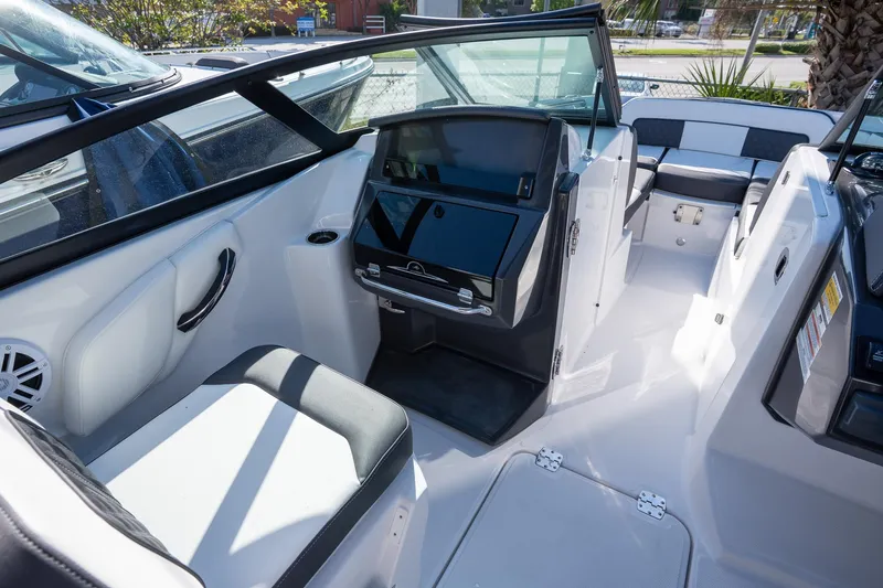 Slide: The Image of 2023 Monterey 275SS boat interior with sleek seating and modern dashboard design. - 24