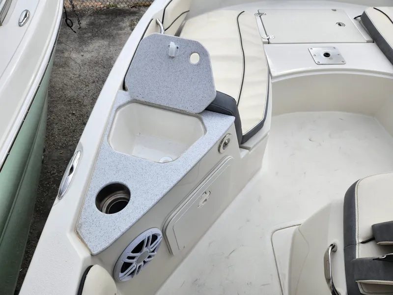 Slide: The Image of 2023 Stingray 206cc boat interior with seating and storage compartments. - 21