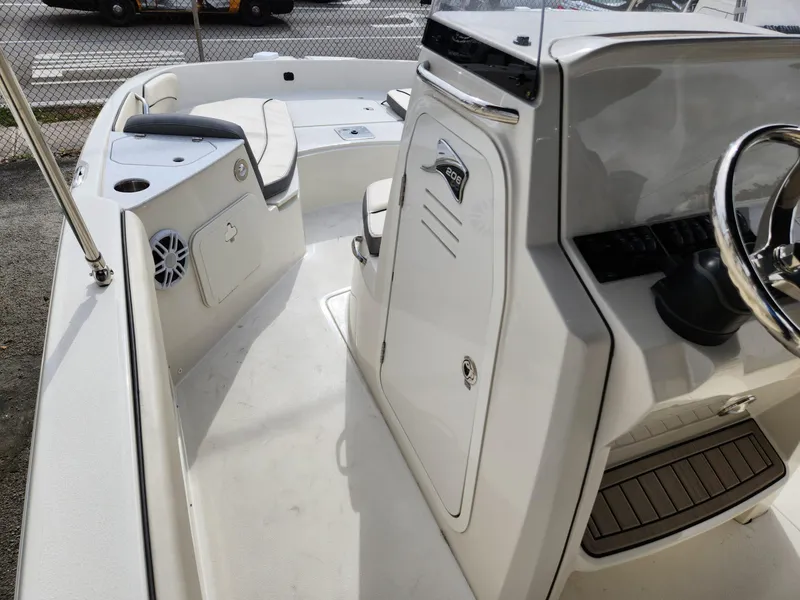 Slide: The Image of 2023 Stingray 206cc boat interior with seating and steering console. - 30