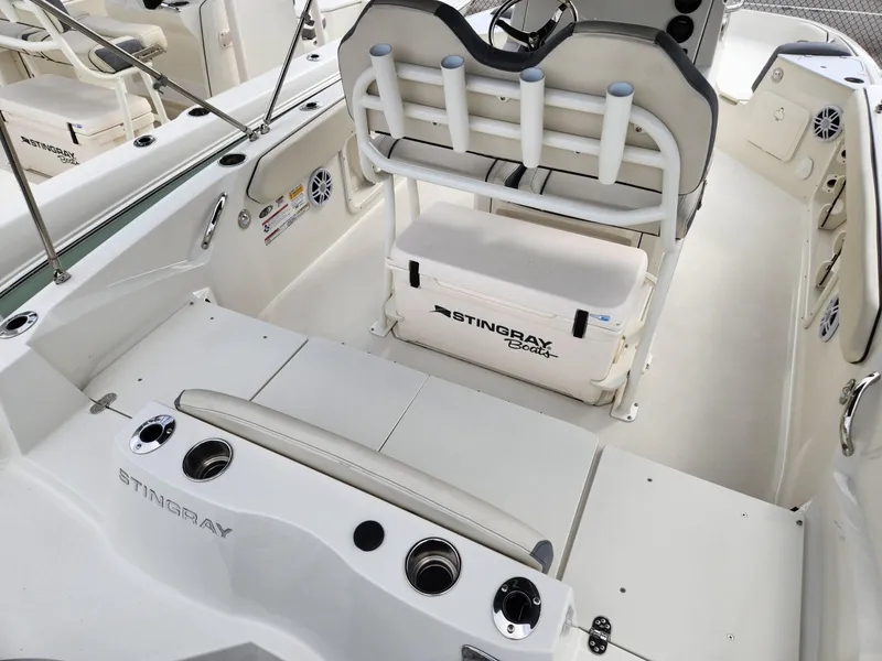 Slide: The Image of 2023 Stingray 206cc boat interior with seating and storage features. - 6