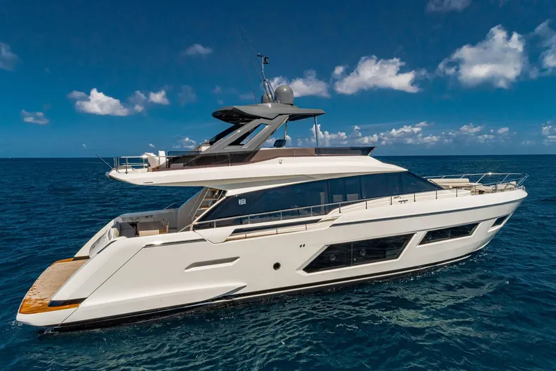 Slide: The Image of 2020 Ferretti Yachts 670 cruising on open sea under clear blue sky. - 1