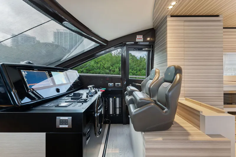 Slide: The Image of Interior helm of 2020 Ferretti Yachts 670 with modern controls and seating. - 17