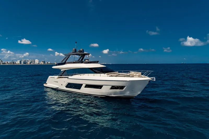 Slide: The Image of Ferretti Yachts 670, 2020 model, cruising on open sea under clear blue sky. - 2
