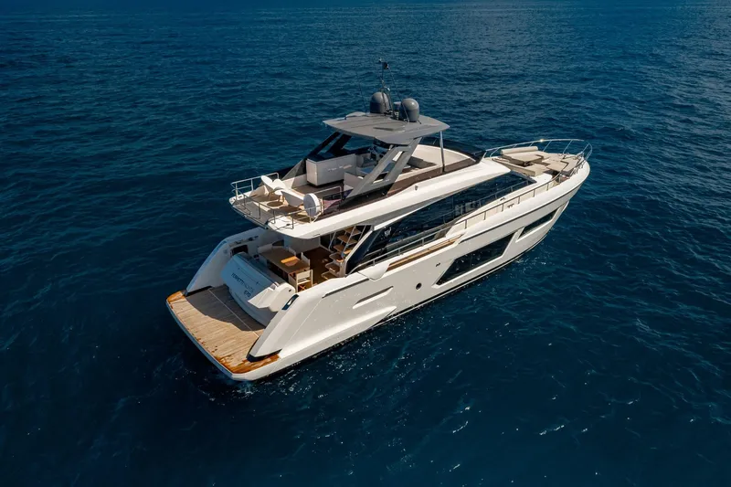 Slide: The Image of 2020 Ferretti Yachts 670 cruising on open sea, showcasing luxury design and spacious deck. - 3