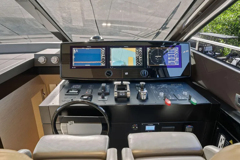 Slide: The Image of 2020 Ferretti Yachts 670 helm with advanced navigation displays and controls. - 31