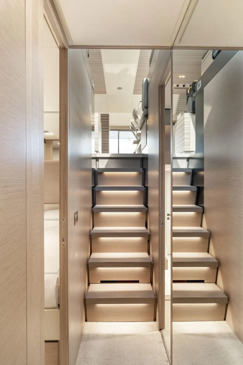 Slide: The Image of Interior staircase of 2020 Ferretti Yachts 670, featuring modern design and sleek finishes. - 32