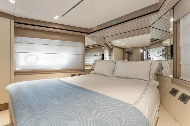Slide: The Image of Luxurious bedroom interior of 2020 Ferretti Yachts 670 with elegant bedding and modern design. - 46