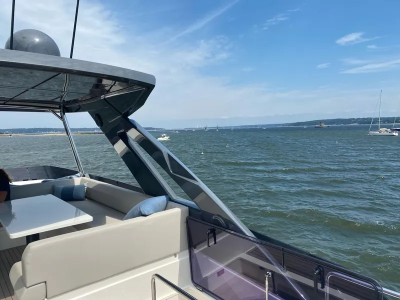 Slide: The Image of Ferretti Yachts 670, 2020 model, cruising on a sunny day with ocean view. - 7