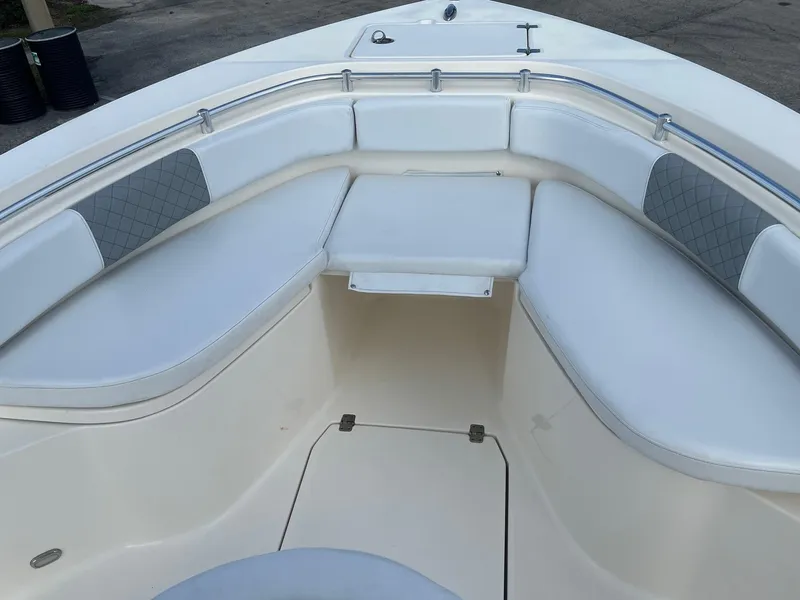 Slide: The Image of 2022 Cobia 237 Center Console boat with spacious seating and sleek design. - 6