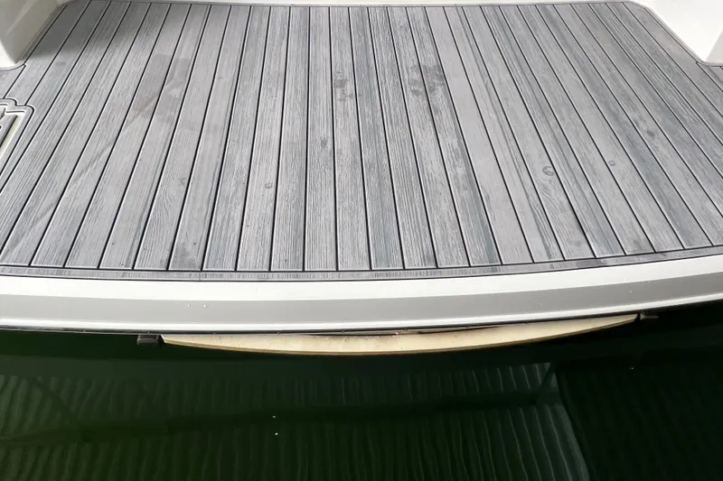 Slide: The Image of 2019 Regal 33 Express boat deck with sleek, modern design. - 10