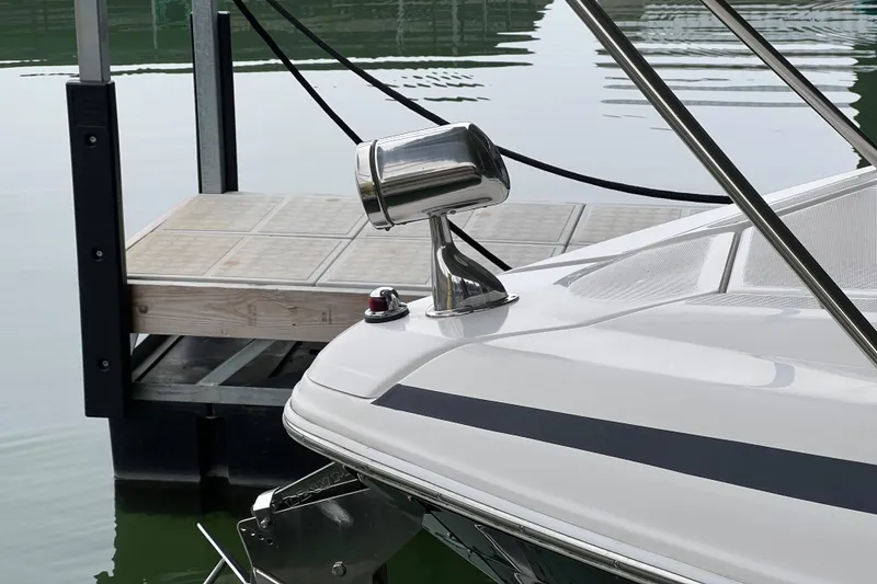 Slide: The Image of 2019 Regal 33 Express boat docked, featuring sleek design and modern fixtures. - 13