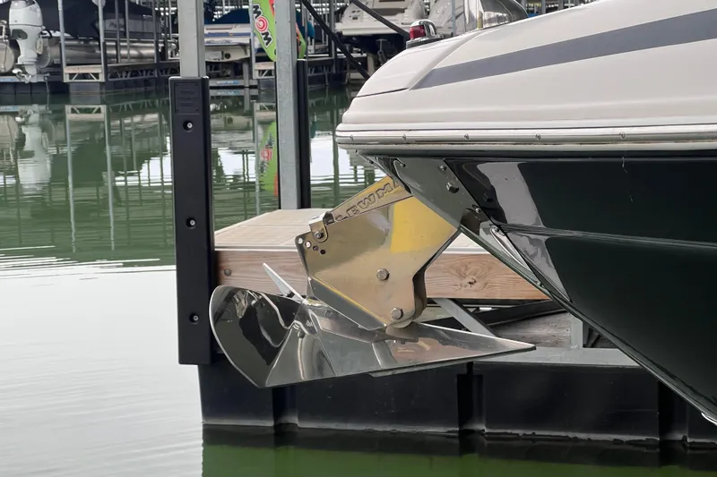 Slide: The Image of 2019 Regal 33 Express boat with stainless steel anchor at dock. - 14