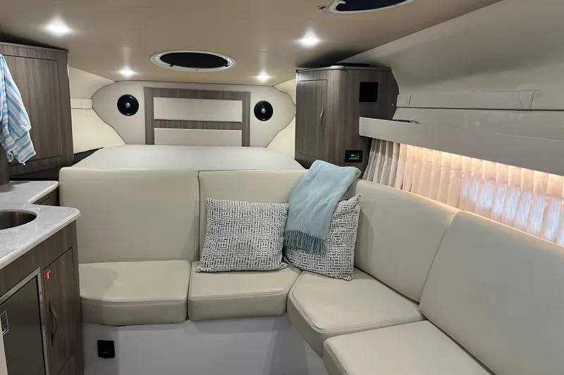 Slide: The Image of 2019 Regal 33 Express cabin interior with modern seating and stylish decor. - 24
