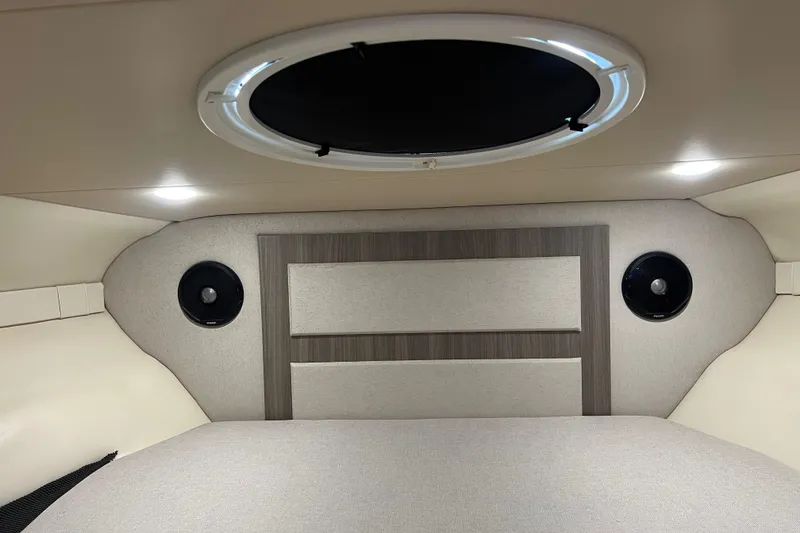 Slide: The Image of 2019 Regal 33 Express cabin interior with circular window and modern design elements. - 27