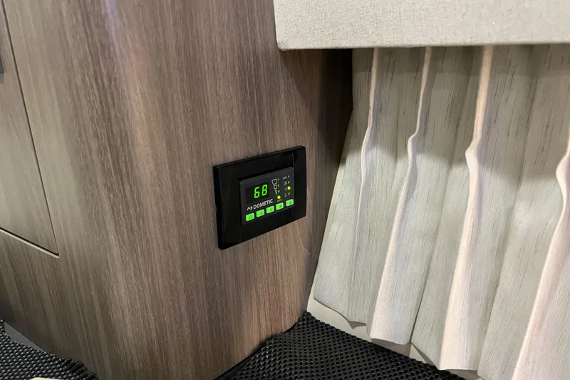 Slide: The Image of Digital thermostat on 2019 Regal 33 Express boat interior wall. - 37