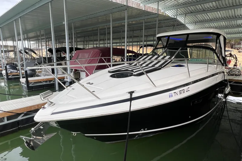 Slide: The Image of 2019 Regal 33 Express boat docked in a covered marina. - 4