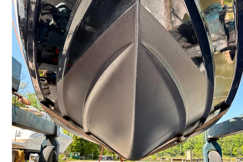 Slide: The Image of 2019 Regal 33 Express boat hull, close-up view, showcasing sleek design and craftsmanship. - 75