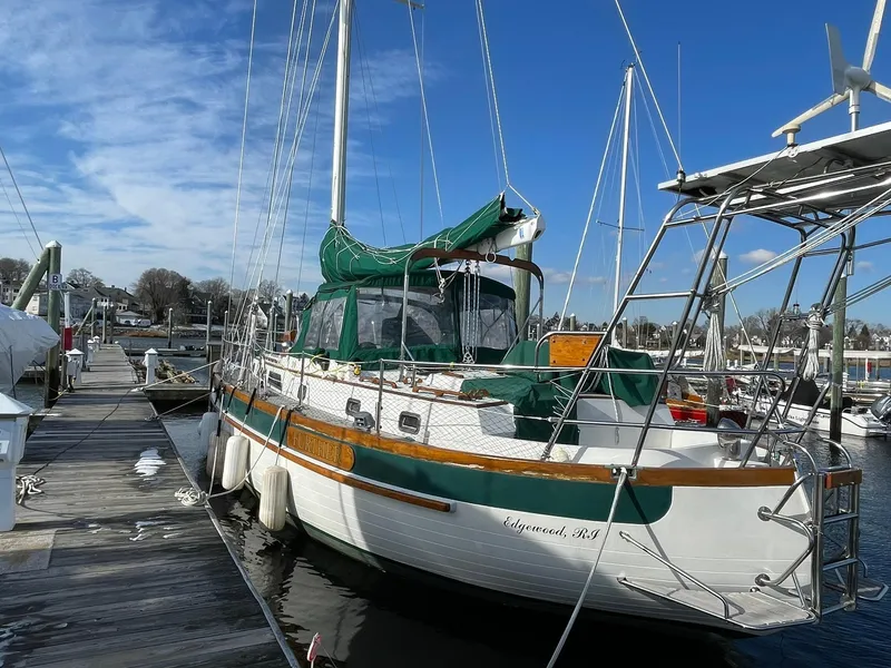 Slide: The Image of Sailboat docked at marina, Passport 51 model, 1987, with green sail cover. - 12